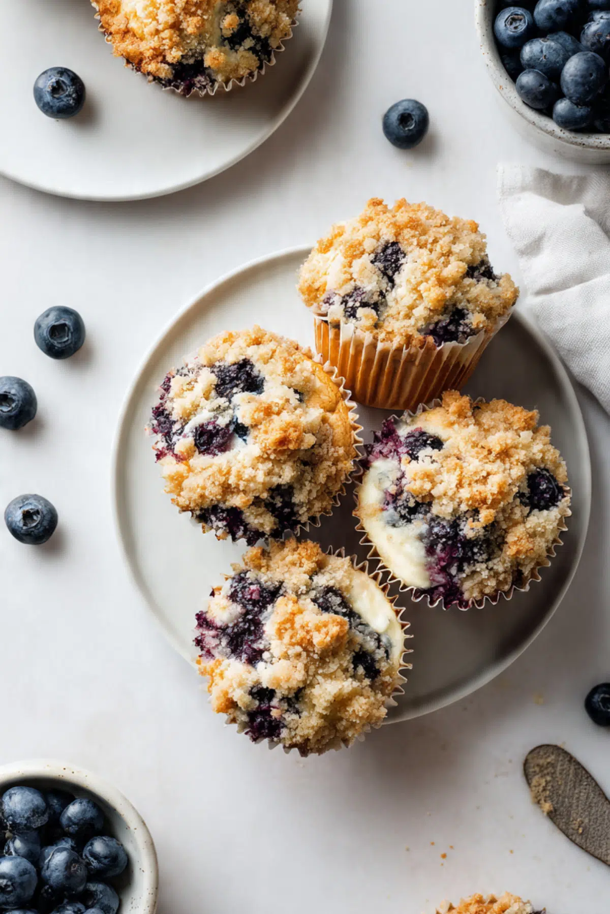 Blueberry Cheesecake Stuffed Crumble Muffins