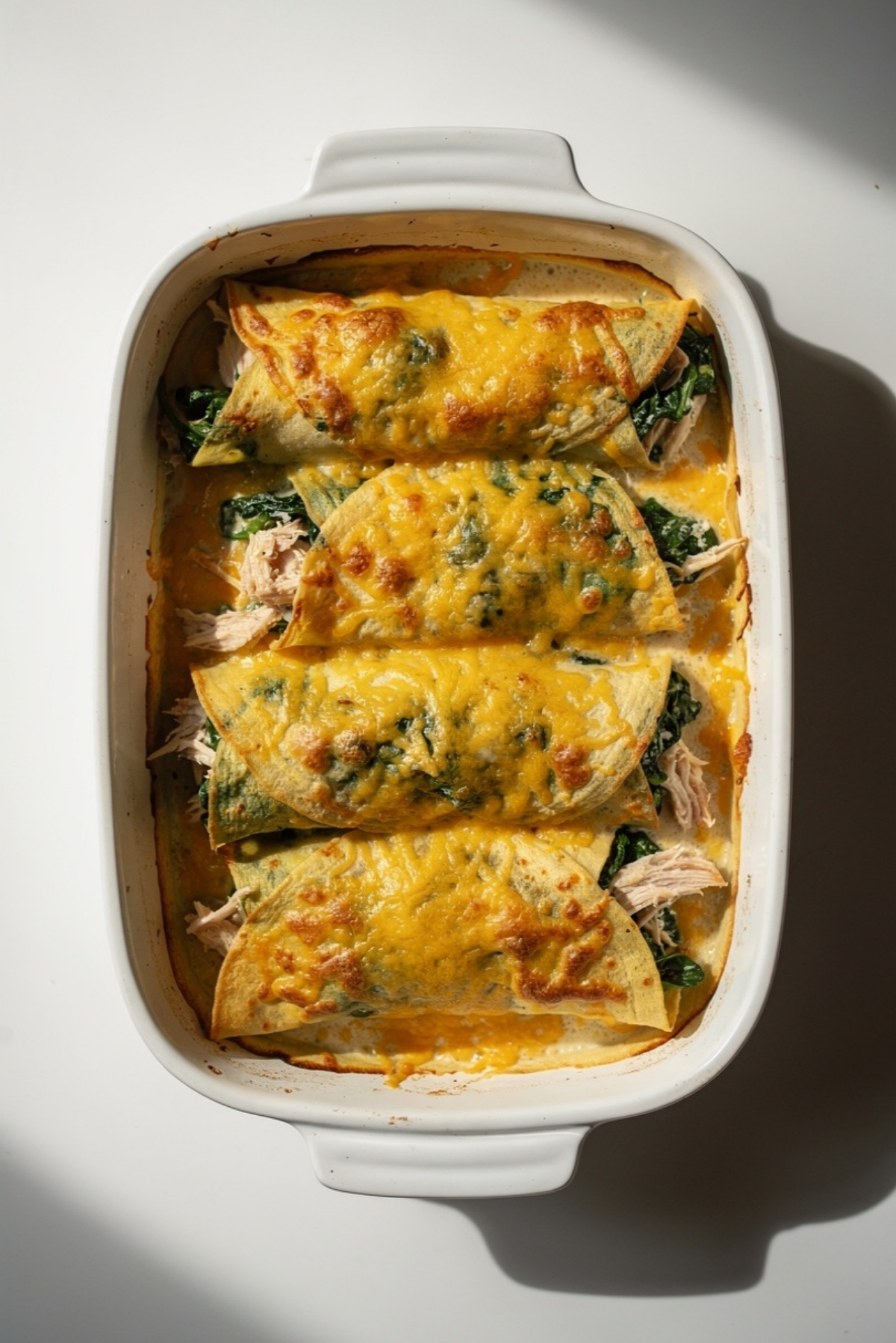 Cheesy Chicken Spinach Stuffed Crepes Bake